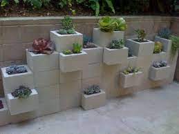 Gardening ideas for concrete walls. 40 Beautiful And Easy Diy Flower Beds To Brighten Your Outdoors Cinder Block Garden Wall Wall Gardens Diy Cinder Block Garden