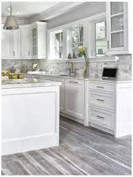 Grey kitchen cabinets with wood floors. White Cabinets Kitchen Grey Floors Whitecabinetskitchengreyfloors In 2021 Grey Kitchen Walls Home Decor Kitchen Grey Kitchen Floor