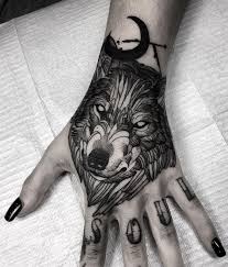 Black And White Wolf Tattoo Hand Wolf Tattoo Inkstylemag White Wolf Tattoo Sleeve Tattoos Hand Tattoos