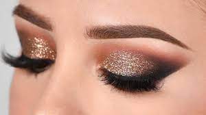 Now take a light brown eyeshadow and apply it slightly above the crease using a soft blending brush. Gold Glitter Smokey Eye Makeup Tutorial Youtube