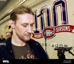 Montreal Canadiens' Alex Kovalev, from Russia, leaves the conference room  after speaking to the media in Brossard, Quebec,