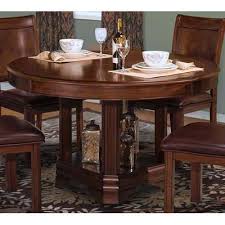 Distinctive style elements include bookmatched veneers framed with contrasting edge banding, inlaid detailing on case tops, reeded pilasters, and antique brass finished hardware, combining tradition with modern day convenience. 40 005 18 18b New Classic Home Furnishings Dining Tables Today Furniture