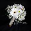 Accented with a fuchsia ribbon, this arrangement of flower blooms makes a cheerful delivered gift for someone special. 1