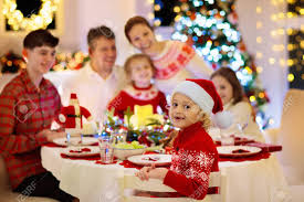 And while i'm certainly sympathetic to impatient kids, it must be said: Family With Children Eating Turkey Christmas Dinner At Fireplace And Decorated Xmas Tree Parents Grandparents And Kids At Festive Meal Winter Holidays Celebration And Food Kids Open Presents Stock Photo Picture And