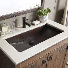 The double vanity set is crafted of solid and manufactured wood, with undermount oval ceramic porcelain sinks. Trough 30 30 Inch Copper Trough Bathroom Sink Native Trails