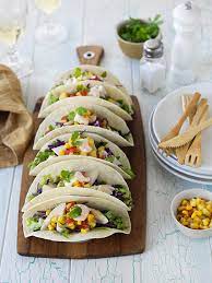 Shrimp sautéed shrimp cooked in garlic butter & white wine, served with cabbage relish, baja sauce, cotija cheese on a flour tortilla Fish Tacos Farrah S