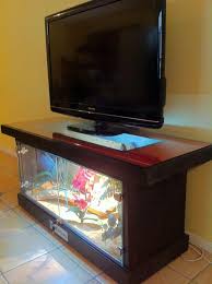 Blue and red leds added to a fish tank coffee table give it a stunning visual impact. Aquarium Tv Table Novocom Top
