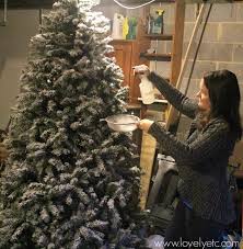 Fake christmas tree makes it fake snow. Diy Flocked Christmas Tree How It Looks Five Years Later Lovely Etc