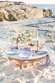 Most Romantic Picnic Sweetheart Table For A Beach Elopement Celebrate Your Elopement With A Sunset Picnic And Beach Wedding White Romantic Picnics Beach Bride