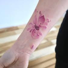 A flower tattoo can come in various sizes, types and colors. 14 Tiny Yet Insanely Beautiful Watercolor Tattoos Revelist