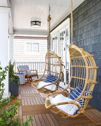 Swinging In A Rattan Dream With A Backdrop Of Navy Shingles We Ve Never Been More In Love Brandonar Front Porch Decorating House With Porch Porch Chairs