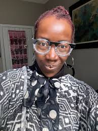 What products or techniques do military women use to manage flyaways and  keep their hair slicked back?