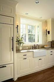Cream Colored Cabinetry And Oil Rubbed Bronze Hardware Pretty Combination Rustic Farmhouse Kitchen Farmhouse Kitchen Cabinets Farmhouse Style Kitchen