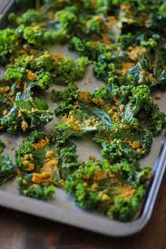 Nacho Cheese Kale Chips Super Crispy And Addicting Made With Tahini And Nutritional Yeast Vegan He Roasted Kale Chips Nutritional Yeast Recipes Kale Chips