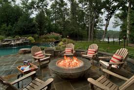 With their iconic silhouettes and spacious seats, adirondack chairs look especially inviting when grouped around a roaring patio fire pit. Fire Pit Chair Houzz
