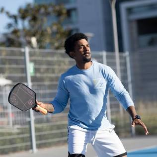 Harder outdoor balls deliver fast bounces and sharp feedback off the paddle face, AI generated