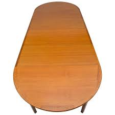 This table is very good quality. Large Danish Teak Round Dining Table Four Skirted Leaves Seats 12 At 1stdibs