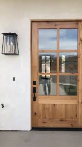 Natural Wood Farmhouse Door With Matte Black Accents Modernfarmhouseentry House Exterior Exterior Doors Wood Doors Interior