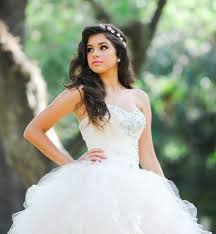 Bun hairstyles have been the hottest cute and easy hairstyle of 2013 but this fancy version if perfect for a quince. Quinceanera Hairstyles 2018 2019 Ideasparamisquince Com