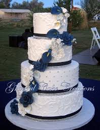 Elegant White Butter Cream Wedding Cake With Navy Blue Ribbon And Bling Accented With Navy Blue White And Silver Sugar Paste Flowers Cream Wedding Cakes Wedding Cake Navy Navy Blue Wedding