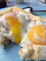 Just dig in, break the yolk and wait until it soaks the upper layer of the bread. Poached Eggs With Roti Bakar Picture Of Roti Canai Transfer Road George Town Tripadvisor
