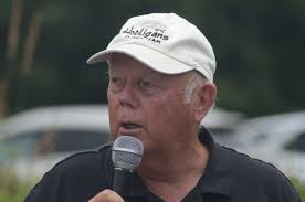 Airplane flyover and motorcycle parade honor retired veterans