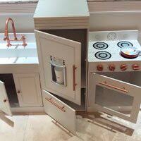 The realistic fridge has an ice maker with toy ice cubes, and can be separated from the sink and stove to accommodate your child's play space. Teamson Kids Little Chef Paris Play Kitchen Set Reviews Wayfair