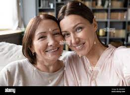 Web cam view young woman taking selfie with mother Stock Photo - Alamy