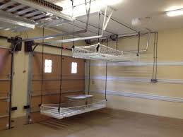 Overhead garage storage opens up much more usable space, especially for items not often used, by essentially using the ceiling as extra floor space. Overhead Garage Storage Diy Overhead Garage Storage Garage Storage Systems Overhead Garage Storage