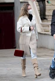 Shop the exact or find similar products identified on spotern. Ester Exposito In A White Coat Jeans And Camel Boots