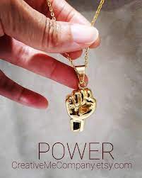 Black Power Fist Necklace Black Lives Matter Gold Fist Etsy In 2021 Afrocentric Jewelry Jewelry Branding Black Jewelry
