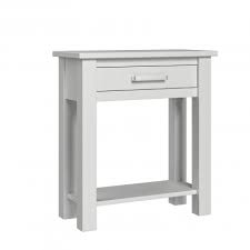This narrow console table fits into the hallway with just enough room for two the marble tabletop complements the white tiles, while bright flowers and bowls add a vivid touch of color. Portland Small Console Table