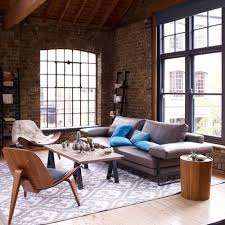 Exquisite traditional living room boasts a red brick fireplace finished with a white mantel located light gray brick fireplace with an oak mantel in a living room furnished with a gray sectional and blue. 77 Cool Living Rooms With Brick Walls Digsdigs
