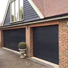 two beautiful sectional garage doors one double and one single width garage architecture garage door styles sectional garage doors garage door types