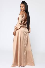 Get this simple yet sophisticated dress for any casual dinner party in town. Mansion Dinner Party Satin Gown Gold Brown Satin Gown Gown Gold Fashion