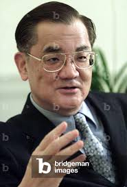 Image of Lien Chan, chairman of Taiwan's main opposition Nationalist Party,  gestures