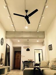 Track Lights And Black Ceiling Fan Living Room Lighting Track Lighting Fixtures Track Lighting Kitchen