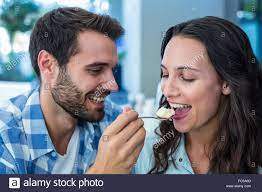 Download This Stock Image Young Happy Couple Feeding Each Other With Cake Fc5a6d From Alamy S Library Of Millions Of High Re Happy Couple Photo Stock Photos