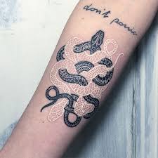 In fact, the only color on their body are their dark brownish black eyes. Black And White Snake Tattoos By Mirko Sata Bored Panda