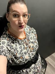 Woman in colorful black dress gets compliments