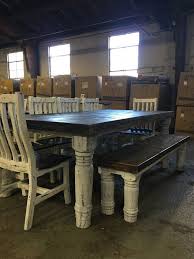 The table is distressed markings throughout. Rustic Canyon 8pc White Distressed Dinette Mes 15 Sil 06 Ban 14 Dining Room Groups Rustic Dining Room Chairs Farmhouse Dining Room Table Rustic Kitchen Tables