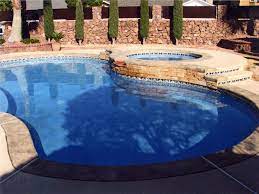Stone Wall Along Fence Pool Contractors Backyard Pool Indoor Swimming Pools