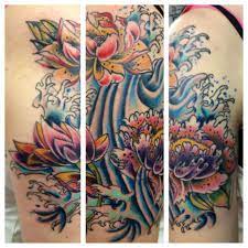 Japanese Flowers And Finger Waves On Right Upper Shoulder Done By Nick Clattenburg Waves Tattoo Tattoos Flower Tattoos