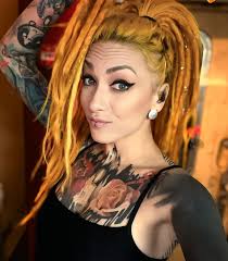 Lena Scissorhands is the raw, untamed heart of modern metal—a visual and  sonic storm who blurs the lines between chaos and control. In any photo,  she radiates an energy that's both wild