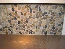 The tiles interlock to create a virtually seamless appearance. River Rock Backsplash Rock Backsplash River Rock Backsplash Diy Backsplash