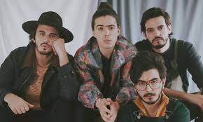 Morat is a colombian band formed in the country's capital city, bogotá.the band is formed by juan pablo isaza (guitars and vocals), juan pablo villamil (banjo and vocals) and the brothers simón vargas (bass and choruses) and martín vargas (percussion and choirs). Morat Talks Inspiration For Bajo La Mesa Music Video With Sebastian Yatra