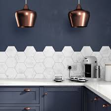 This formerly dark and uninteresting kitchen gets a whole new life with beautiful blue cabinetry, delicate pendants and roman shades with a subtle graphic print. British Ceramic Tile The Home Of Designer Tiles Online Trendy Kitchen Tile Kitchen Tiles Backsplash Kitchen Flooring