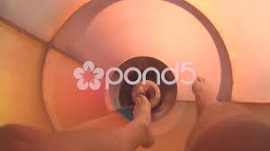 POV of feet going down tube slide at wat... | Stock Video | Pond5