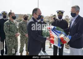 PIRAEUS, Greece (April 28, 2021) Lt. Cmdr. Steve Hulse, Commanding Officer  of USCGC Charles Moulthrope (WPC 1141), receives a plaque from the Hellenic  Coast Guard Commandant, Vice Adm. Theodoros Kliaris. Charles Moulthrope