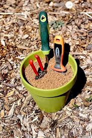 Make Your Own Self Cleaning Sharpening Garden Tool Holder One Good Thing By Jillee Garden Tool Holder Clean Garden Tools Garden Tools